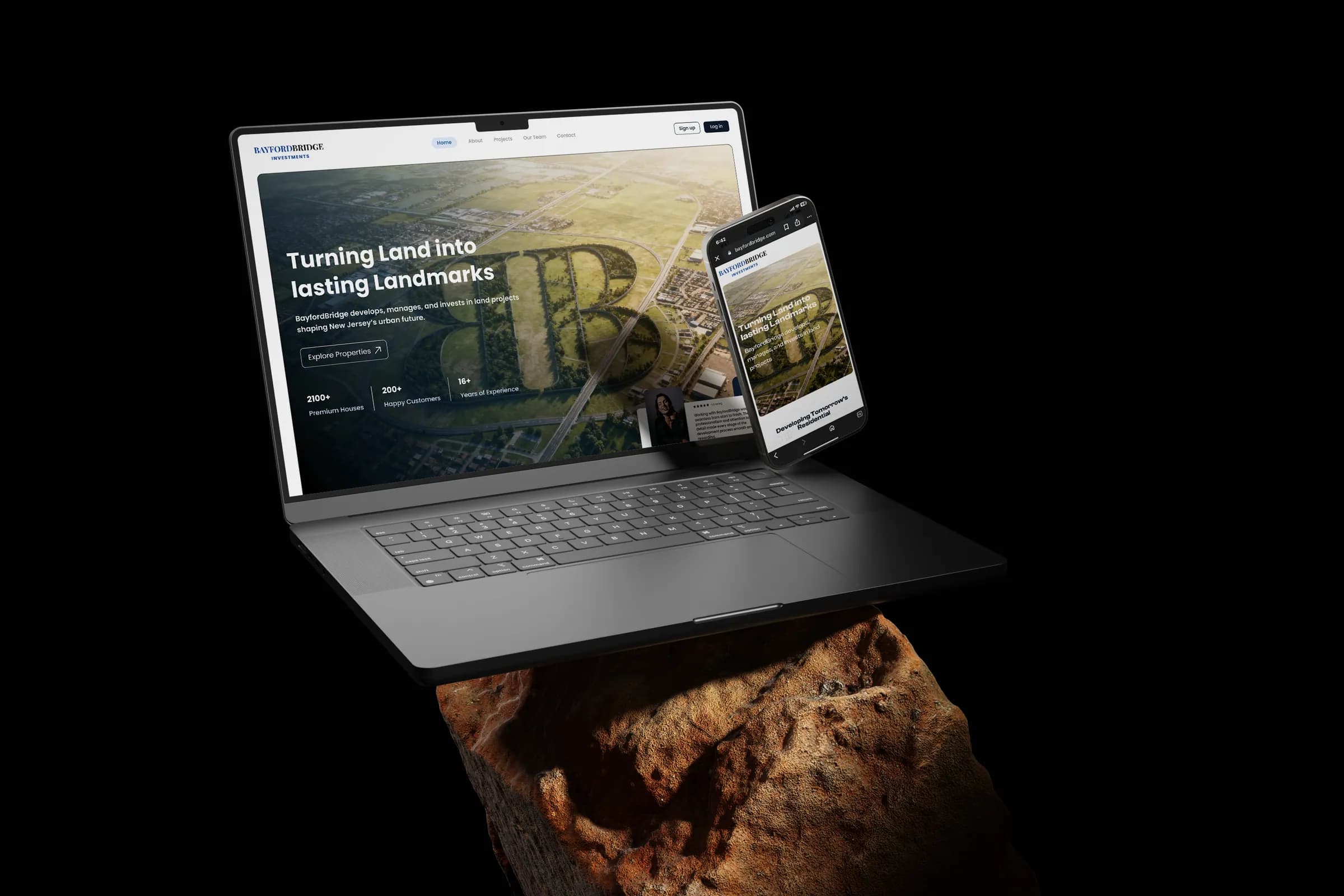 BayfordBridge website on a laptop and phone over rock, dark scene